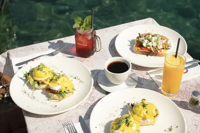 Seaside brunch spread with coffee and fresh juice
